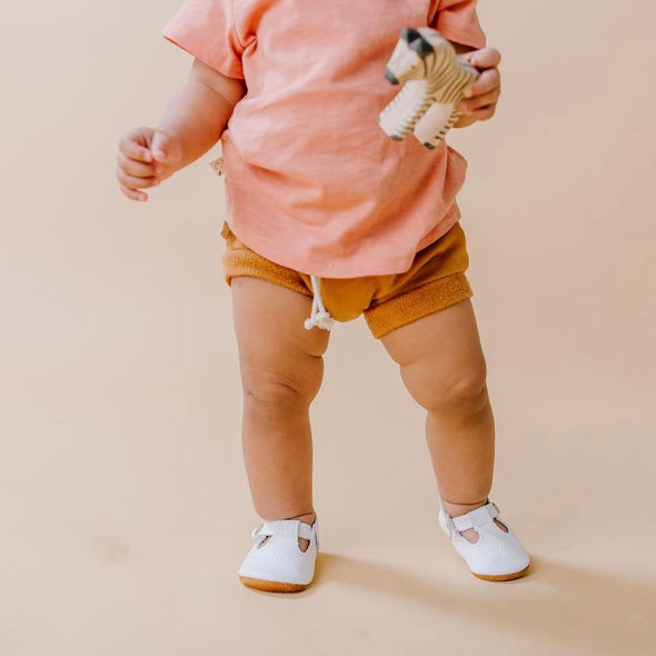 the original soft soled t-strap: white